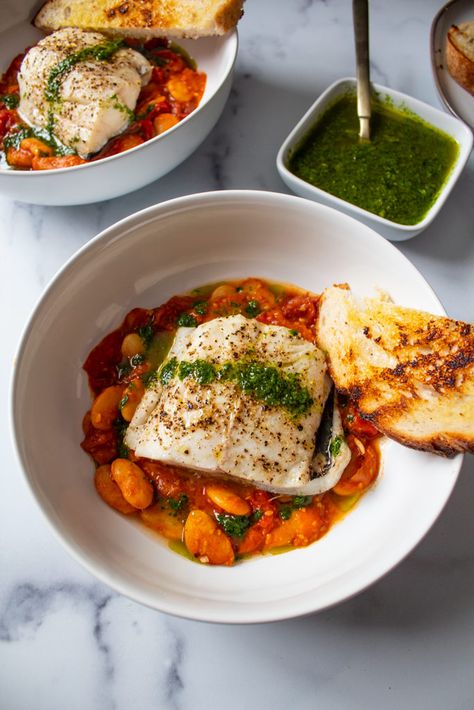 Baked Fish Over Tomato Bean Stew with Herb Oil | Jen's Rooted Kitchen Fish And Tomatoes, Oily Fish Recipes, Winter Fish Recipes, Healthy Homesteader, Yacht Food, Homesteader Recipes, Pesto Fish, Fish Tomato, Braised Fish