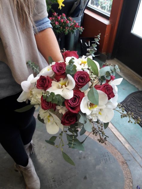 White and dark pink bridal bouquet using roses, phaleonopsis orchids, stephanotis, and eucalyptus. Made at at Oberer's Flowers in Cincinnati. Roses And Orchids Bouquet, Phaleonopsis Orchids, Orchids And Roses, Pink Bridal Bouquet, Valentine Bouquet, Bridal Bouquet Pink, Orchid Bouquet, Roses Bouquet, Pink Bridal