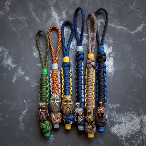 Practicalix Paracord Knife Hand Lanyard Holder Viking Spartan Warrior 💎 #EDCKnifeBeads #KnifeAccessories #EverydayCarry #EDC #GearCustomization #TacticalBeads #ParacordBeads #HandcraftedBeads #ArtisanBeads #KnifeCollecting #KnifeEnthusiast #GearUpgrade #UniqueBeads #FunctionalArt Knife Lanyard Paracord, Paracord Weaves, Paracord Knife, Knife Lanyard, Paracord Accessories, Paracord Lanyard, Edc Gadgets, Head Skull, Diamond Knot