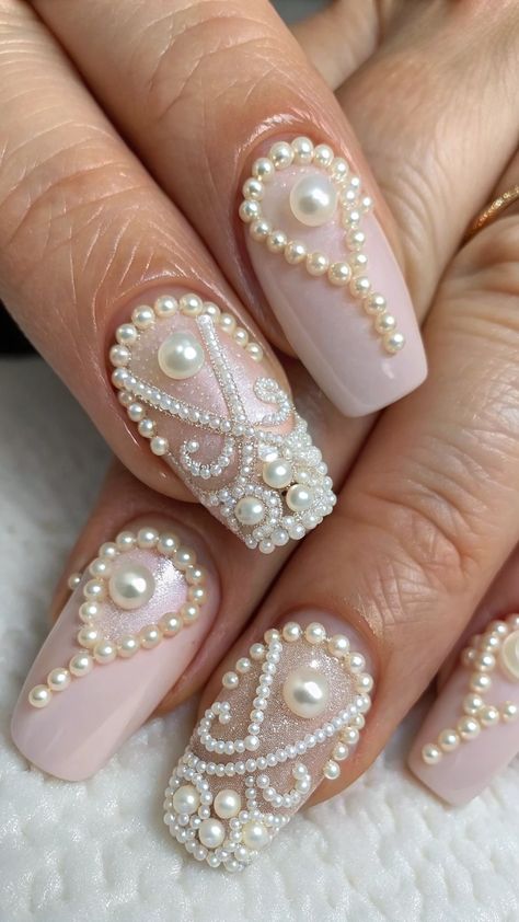 Soft nude or pink nails adorned with tiny pearls. #PearlNails #TimelessElegance #GlamClaws Nail Ideas With Pearls, Pink Nails With Pearls, White Pearl Nails, Nails With Pearls, Pearl Nails, White Pearl, Pink Nails, Timeless Elegance, Nails