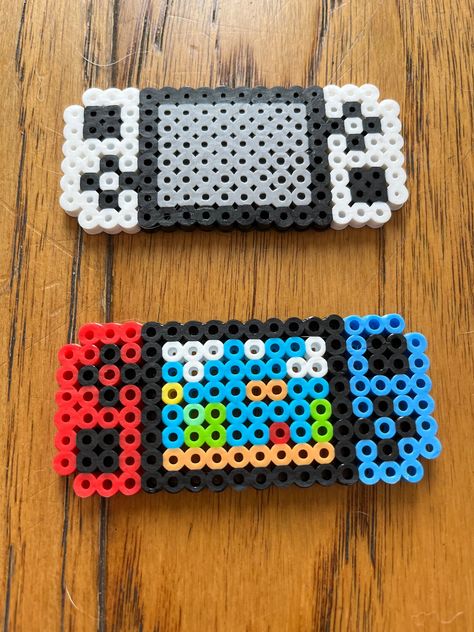 Handmade perler bead designs created by a 9 year old who loves to craft! Peeler Bead Ideas Square, Fall Melty Beads, Perler Bead Bouquet, Outer Banks Perler Beads, Perler Bead Templates Small, Shadow Perler Beads, Cool Fuse Bead Ideas, Teacher Perler Bead Patterns, Dr Pepper Perler Beads