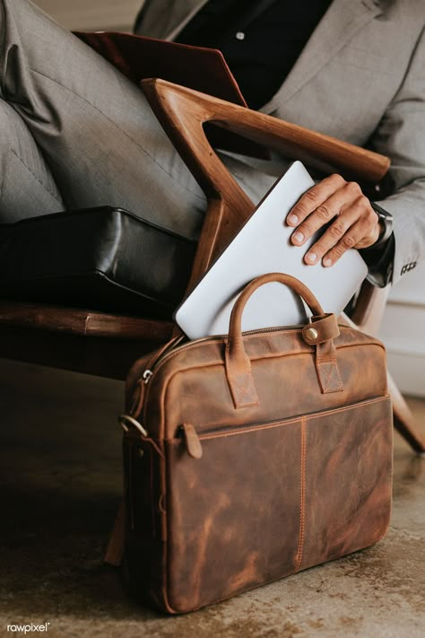 Classy businessman putting his laptop in his brown leather bag | premium image by rawpixel.com / Felix Briefcase Aesthetic, Vintage Briefcase, Unique Products Design, Office Bag, Brown Leather Bag, Brown Aesthetic, Luxury Vintage, Personal Branding, Business Man