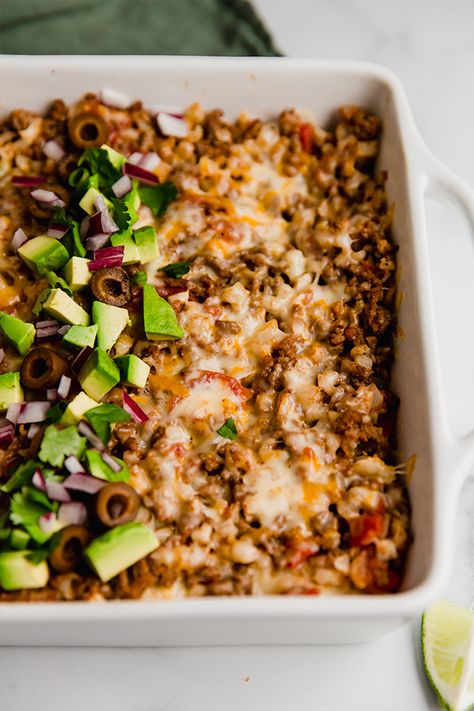 This taco cauliflower rice casserole is made with ground beef and cauliflower rice-filled layered in between grain-free tortillas! It's gluten-free, and can easily be made dairy-free and paleo. Paleo Casseroles, Taco Cauliflower Rice, Paleo Taco, Paleo Casserole, Cauliflower Rice Casserole, Unbound Wellness, Paleo Dinners, Healthy Casserole Recipes, Frozen Cauliflower Rice