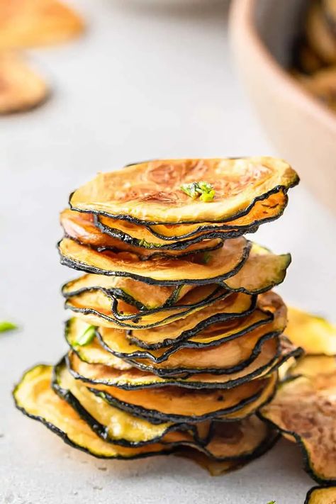 The dehydrator is the BEST way to get perfectly crispy zucchini chips! Here’s how to make them at home. Dehydrating Zucchini In Dehydrator, Squash Chips Dehydrator, Zucchini Dehydrator Recipes, Dehydrate Zucchini Chips, How To Dehydrate Zucchini, Zucchini Chips Dehydrator Recipes, Dehydrated Zucchini Noodles, How To Make Zucchini Chips, Dehydrated Zucchini Recipes