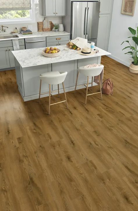 Introducing Mannington's Charter Collection™ laminate flooring in the color Sand, named Phoenix. With its on-trend Oak look, this 8mm thick laminate floor is both stylish and durable. The 2mm attached pad adds comfort and noise reduction. Enjoy the spacious 8" wide planks, each measuring 48" in length. Upgrade your space with the timeless beauty and practicality of Phoenix laminate flooring. Mannington Adura, Flooring Materials, Wide Plank, Wood Laminate, Traditional Interior, Luxury Vinyl Plank, Wood Planks, Nebraska Furniture Mart, Laminate Flooring