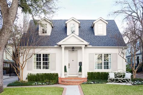 12 Best Exterior Paint Colors For Brick Houses Swiss Coffee Painted Brick Exterior, Brick House Painted Blue, Best Roof Color For White House, Classic Exterior Paint Colors, Roof Colors For White House, Light Brown Roof Exterior Colors, Painted Brick Cottage, White Colonial House Exterior, Cream Brick House Exterior