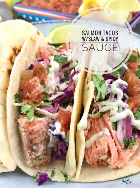 How to cook simple salmon tacos that are topped with slaw, spicy cream sauce and salsa. A healthy meal for under 500 calories per serving that provides 29 grams of protein, 4 grams of fiber, 15% of the daily value for potassium and omega-3 fatty acids. Salmon Tacos Recipe With Slaw, Salmon Tacos With Slaw, Spicy Cream Sauce, Tacos With Slaw, Salmon Tacos Recipe, Everyday Dinners, Mediterranean Meals, Salmon Tacos, Fish Taco