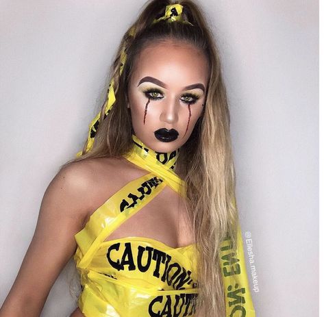 Caution ⚠️ / caution tape / homemade costume / easy Halloween look / easy Halloween costume / simple costume / police tape / fake blood / Halloween makeup / Halloween / makeup / yellow eyeshadow / smokey eye / gothic / black lips / black lips / contour / sexy Halloween / crying blood / yellow makeup / false eye lashes / yellow contact’s . Caution Tape Halloween Costume, Caution Makeup, Escape Halloween Outfits, Caution Tape Costume, Police Makeup Halloween, Caution Tape Outfit, Risky Business Costume, Fitness Barbie, Great Costume Ideas