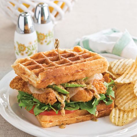 These Chicken and Waffle Sandwiches are a special treat layered with chicken tenders, Cheddar, provolone, tomatoes, arugula, and avocado slices. You can also use frozen waffles instead of making them yourself, if you prefer. Sandwiches With Bacon, Waffle Sandwiches, Cornbread Waffles, Fried Chicken And Waffles, Waffle Sandwich, Chicken And Waffles, Bacon Cheddar, Green Onion, Waffle Recipes