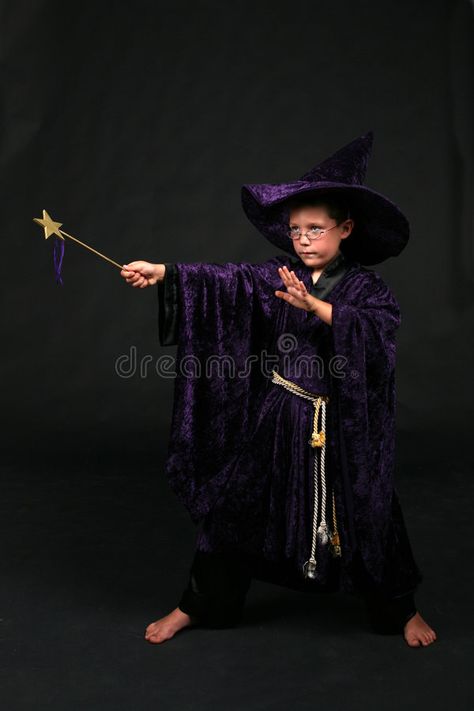 Wizard boy with magic wand casting a spell. Wizard boy in purple velvet hat and #Sponsored , #Affiliate, #wand, #casting, #spell, #Wizard, #boy Holding A Wand Poses, Boy Witch Costume, Casting Spell Pose, Spell Casting Pose Reference, Magical Boy Outfit, Wizard Casting Spell, Wizard Clothing, Children Reference, Casting A Spell