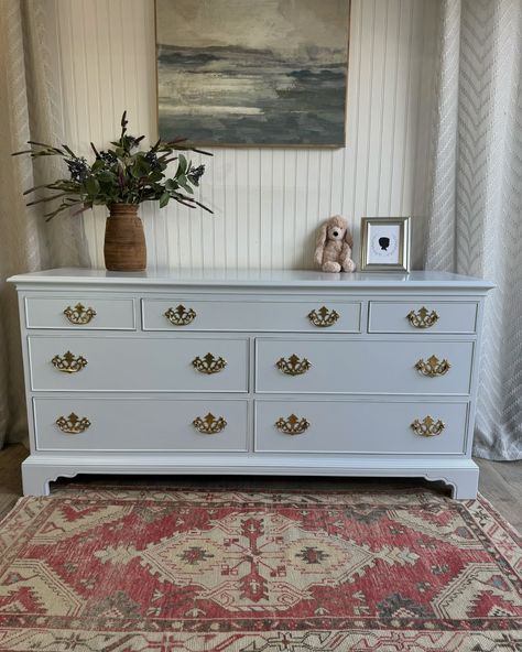 🌿AVAILABLE🌿 Vintage Drexel 7 Drawer Dresser newly refinished in the @sherwinwilliams color of the year, Upward. This is the softest most gorgeous blue color with a slight silver undertone. To me this one screams nursery or grandmillennial style. The details on the bottom of this dresser are beautiful and the original hardware was simply polished and kept intact with this beauty. The top three drawers have been lined with a simple grey and white wallpaper to add just a little extra pop. All ... Blue Dresser Nursery, Dresser In Living Room, Grey And White Wallpaper, Grandmillennial Style, Blue Dresser, 7 Drawer Dresser, Drawer Dresser, White Wallpaper, Color Of The Year