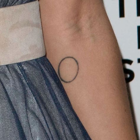 Zoë Kravitz Circle Forearm Tattoo | Steal Her Style Circular Tattoo Placement, Circle Tattoo Placement, Round Tattoo Placement, Geometric Circle Tattoo, Zoe Kravitz Tattoos, Circle Tattoo Meaning, Enso Tattoo, Tattoo Circle, Circular Tattoo