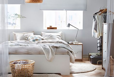 A white IKEA ASKVOLL bed frame in a bright, contemporary bedroom with other bedroom furniture. Askvoll Bed, Ikea Askvoll, Ikea Bedroom Sets, White Bedroom Chair, Flat Inspiration, White Bathroom Furniture, Design Ložnic, Scandinavian Design Bedroom, Ikea Design