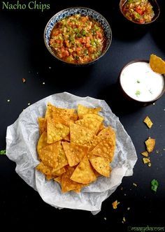 homemade tortilla chips Ingredients 3/4 cup Maize Flour / Makki Ka Atta 1/2 cup Refined Flour / Maida 1/3 tsp Red Chilli powder / Laal mirch powder 1/3 tsp Oregano Salt / Namak Cooking Oil to deep fry Servings: Units: Instructions In a big bowl add all the ingredients and mix well. Add Luke warm water to make a medium soft dough. Knead it for a minute. Make small size balls from the dough and keep aside. Roll them to make round size tortillas, thickness should be similar to a chapati or tortil Homemade Nacho Chips, Nacho Chips Recipe, Salty Biscuits, Nachos Chips, Nacho Recipes, Oregano Salt, Tortilla Chip Recipe, Homemade Nachos, Baked Tortilla Chips