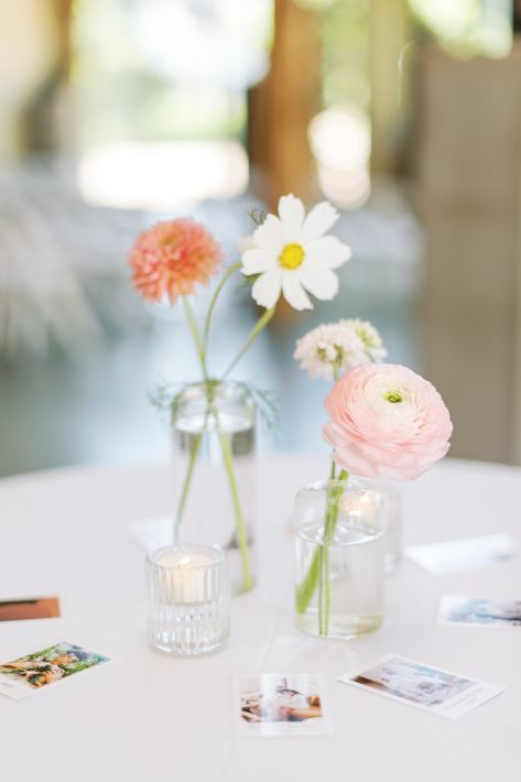 Spring flower arrangements centerpieces bud vases Centerpieces Bud Vases, Spring Flower Arrangements Centerpieces, Daisy Centerpieces, Bud Vases Wedding, Bud Vase Centerpiece, Bud Vases Flowers, Summer Flower Arrangements, Simple Nursery, Table Assignments