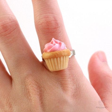 Does size really matter? This tiny but cute ring can complete your whole look! The cupcake is 3/4 inch tall, handmade from polymer clay with adjustable ring. The Scented Birthday Cupcake Ring features a miniature strawberry cupcake with a pink piped icing on top. The scent of this food jewelry will definitely make you hungry, it smells like freshly baked muffins! It is one of the best birthday presents to give friends and loved ones. Buy now and make that special someone happy. Cupcake Ring, Strawberry Muffin, Kei Jewelry, Strawberry Cupcake, Kawaii Necklace, Strawberry Muffins, Food Shapes, Strawberry Buttercream, Cute Ring