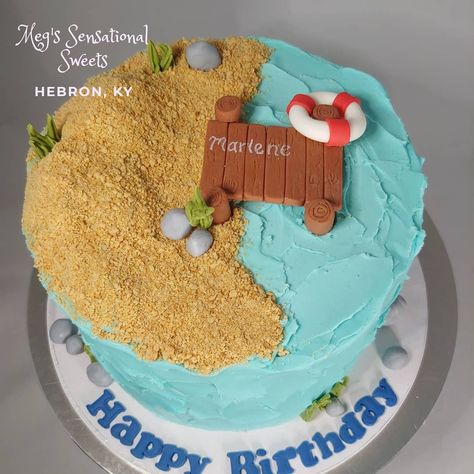 Lake themed cake with a dock and sand dunes Lake Themed Birthday Party, Lake Birthday Cake, Lake Themed Birthday Cake, Lake Cake Ideas, River Cake Ideas, Diy Fishing Cakes For Men, Cami Cakes Fishing, Lake Cake, Beach Birthday Cake