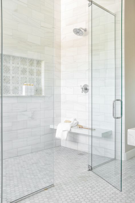 The Basil + Tate team just completed this new-build Denver home’s primary bathroom suite, and we can’t wait to show you around. The Nowicki Project’s light and bright primary bathroom features natural stone and polished marble with a mosaic focal point, achieving a high-end yet timeless look. We also included mixed metals, custom cabinetry, and blush pink accents throughout the space. Tap to see the full reveal on the blog! Masterbath Ideas, Mom Bathroom, Bathroom Pics, Timeless Bathroom, Primary Suite, Marble Showers, Shower Floor Tile, Solana Beach, Bathroom Redesign