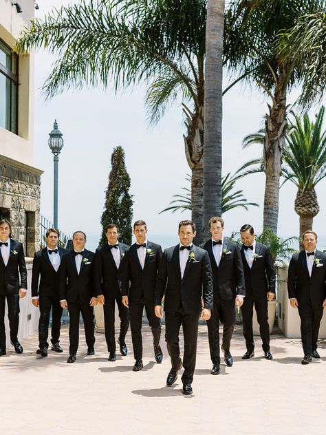 Groomsmen in black tux at southern california beach wedding Tux Beach Wedding, Groomsmen In Black, Bel Air Bay Club Wedding, Groomsmen Black, Beach Wedding Groomsmen, California Beach Wedding, Southern California Beaches, Black Tux, California Beach