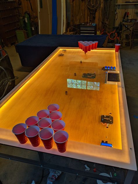 Top of the line beer pong table with built-in players list. Here, a steel keyboard and LCD screens under the surface replace a traditional paper and pen list. This way, the list is tamper-proof and guaranteed to work. The table keeps score and tracks win-streaks. How does it work? Players just come up to the side of the table, enter their names on the list, and start playing. Everyone else can add themselves to the list and see who's up next without disturbing the game - same way it works now, j Beer Die Table, Diy Beer Pong Table, Custom Beer Pong Tables, Beer Pong Table Designs, Beer Olympics, Drinking Games For Parties, Tournament Games, Beer House, Beer Pong Tables