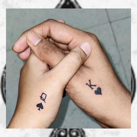 The tattoo showcases the symbols "Q ♠" (Queen of Spades) and "K ♥" (King of Hearts) and holds deep meaning for the couple. It's a beautiful representation of the strong connection between the two individuals, portraying them as the King and Queen in each other's lives. The choice of card suits—spades and hearts—reflects a harmonious balance of different personality traits or aspects of their relationship. The queen of spades embodies creativity and foresight, symbolizing a woman who is always... Queen Card Tattoo For Women, King Card Tattoo, K King, Ace Of Spades Tattoo, Queen Of Hearts Tattoo, Spade Tattoo, Different Personality, King Card, Card Suits