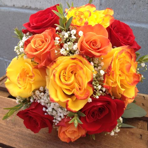 Red, yellow, and orange roses arranged in a bridal bouquet. Simple, colorful, and classy for a fall ceremony. Orange And Red Roses Bouquet, Red Orange And Yellow Flowers, Yellow And Orange Roses Bouquet, Mcdonalds Wedding, Wedding Bouquet Yellow, Quinceañera Planning, Yellow Rose Wedding, Orange Rose Bouquet, Rose Bouquet Wedding