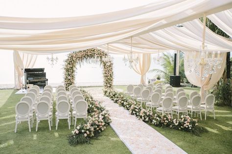 Nothing will stop this lush Phuket wedding from being number 1 in our hearts! A ceremony arch abundant with blooms, a gown dusted with gems and the cutest little page boys we ever did see, you will do yourself a favor to see more of this seaside garden wedding. The wedding cabana you see here is just a little taste! #ruffledblog Garden Wedding Ceremony Arch, Tent Wedding Ceremony, Wedding In Garden, Wedding Cabana, Garden Wedding Gown, Wedding Garden Decoration, Outside Wedding Ceremonies, Ceremony Decorations Church, Wedding Ceremony Decorations Church