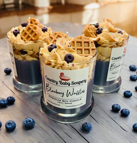 🥞✨ Back by Popular Demand! ✨🥞 We’re excited to announce that our customer-favorite Blueberry Waffles Premium Soy Candle is back in stock! 🫐🍇 This deliciously fragrant candle captures the mouthwatering aroma of freshly made waffles topped with sweet, juicy blueberries and a hint of syrup. Each candle is meticulously hand-poured with love and features adorable waffle and blueberry embeds, making it a feast for the senses and a charming addition to any space. 🌟 Hurry and grab yours before the... Blueberry Candles, Blueberry Candle, Candles In A Jar, Candle Making Ideas, Candle Making Recipes, Blueberry Waffles, Velas Candles, Candle Melts, Handmade Soap Recipes