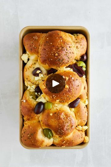 Pull Apart Olive Bread | Pull Apart Olive Bread | By Food Dolls | Did you know you can make
bubble bread using frozen dinner rolls? Just place your
dinner rolls in a loaf pan, add some olives and sun-dried
tomatoes. And once your bread rises, you're going to add some
olive oil, oregano, seasoning, and some feta cheese and pop it
in the oven. And you guys, it becomes the most softest and
easiest bread to make. You'll be coming back for more. Yes,
make sure to follow us for more easy recipes. Yes. Bread Pull Apart, Bubble Bread, Bread To Make, Frozen Dinner Rolls, Frozen Dinner, Feta Cheese Recipes, Food Dolls, Olive Bread, No Rise Bread