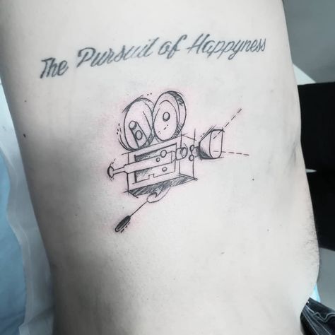 Video camera tattoo design Video Camera Tattoo, Filmmaker Tattoo, Camera Tattoo Design, Camera Tattoos, Scene Tattoo, Laser Removal, Movie Tattoo, Film Tape, Camera Tattoo