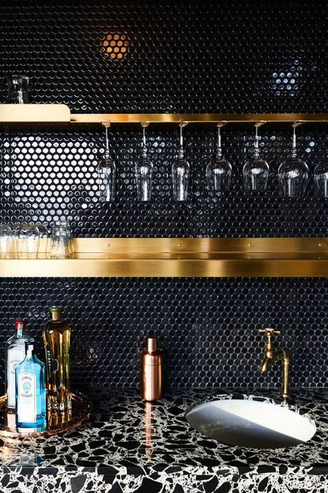 When you think of a bar, you usually think of your neighborhood bar that you hit up to watch a game or meet some friends. But what if you could have a... | Mix Materials for a Trendy, Upscale Bar #basementbar #basement #bar #homedecor #decoratedlife Dark Tile Backsplash, Black Tiles Kitchen, Penny Tile Backsplash, Black Backsplash, Dark Tile, Unique Backsplash, Bar In Casa, Unanswered Questions, Basement Bar Designs