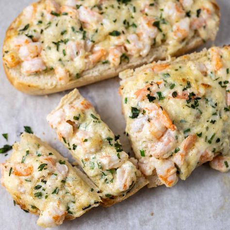 This Shrimp Garlic Bread has a cheesy shrimp mixture on top of a crusty Italian loaf, French baguette slices, or ciabatta crusty bread ready in 25 minutes. Recipe at https://zonaslazyrecipes.com/shrimp-garlic-bread/ Cheesy Garlic Bread Shrimp Grilled Cheese, Italian Loaf, Cheesy Shrimp, Shrimp Grilled, Baguette Slices, Breaded Shrimp, Garlic Cheese Bread, Cheesy Garlic Bread, French Baguette