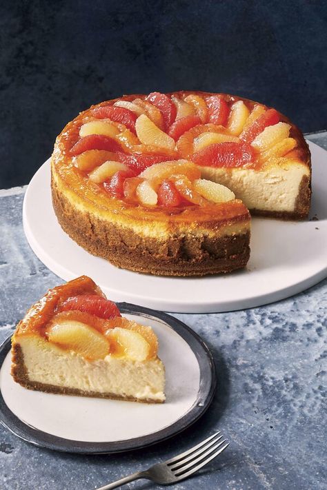 Grapefruit Cheesecake | "A rainbow of in-season grapefruit adds a bright not to this rich, creamy cheesecake. To keep the cheesecake from getting soggy, arrange the citrus on top just before eating. If you have leftover cheesecake, remove the grapefruit and store separately in the refrigerator." #cake #cheesecake #cheesecakerecipes #dessertrecipes #baking #cake #dessert #grapefruitrecipes Grapefruit Cheesecake, Cheesecakes Recipes, Christmas Cheesecake Recipes, Creamy Cheesecake Recipe, Apple Autumn, Cozy Winter Recipes, Grapefruit Recipes, Lithuanian Recipes, Bakery Treats