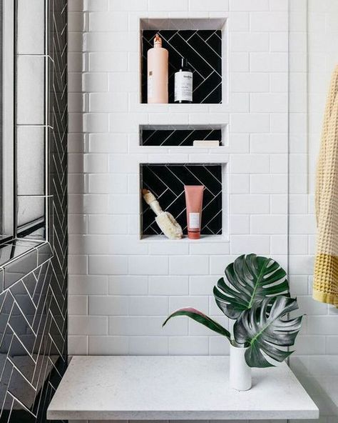 @sarahmontgomerydesign posted to Instagram: Here's another view of our latest bathroom renovation. My favorite part might be the shower niche! I'd also like to give a shout out to @kirstin_ess for making great products to use and style with. Photo by @margaretrajic #sarahmontgomerydesign #sarahmontgomerydesignblog #chicagodesigner #chicagodecorator #iamtheeverygirl #showemyourstyled #apartmenttherapy #chicagodesigncommunity #chicagovintage #ruedaily #interiorinspo #myeclecticmix #mydecorvibe #bl Black White Herringbone Tile, Black And White Herringbone Bathroom, White Shower With Black Niche, Black And White Niche, Black And White Shower Niche, White Shower Black Niche, Black Niche Bathroom, Black And White Bathroom Shower Tile, Black And White Tile Showers