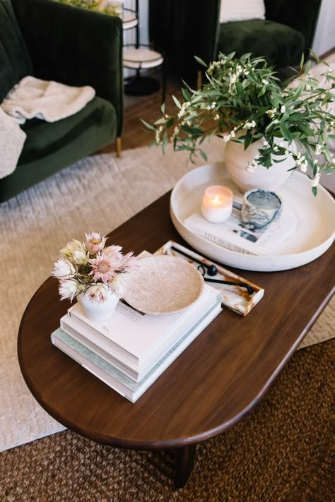 Dark wood coffee table styled with light neutral accessories Dark Brown Rectangle Coffee Table, Hygge Coffee Table Decor, Boho Coffee Table Styling Wood, Living Room Dark Wood Coffee Table, Cream Couch Dark Wood Coffee Table, Brown Office Table Decor, Coffee Table Decor Dark Wood, Dark Wood Modern Living Room, Apartment Decor Dark Wood