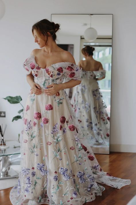 cream colored wedding gowns Floral Non Traditional Wedding Dress, Colored Floral Wedding Dress, Wedding Dress With Pink Flowers, Boho Modern Wedding Dress, Floral Wedding Dress Colored, Unique Colored Wedding Dresses, Multicoloured Wedding, Wildflower Wedding Dress, Colour Wedding Dress