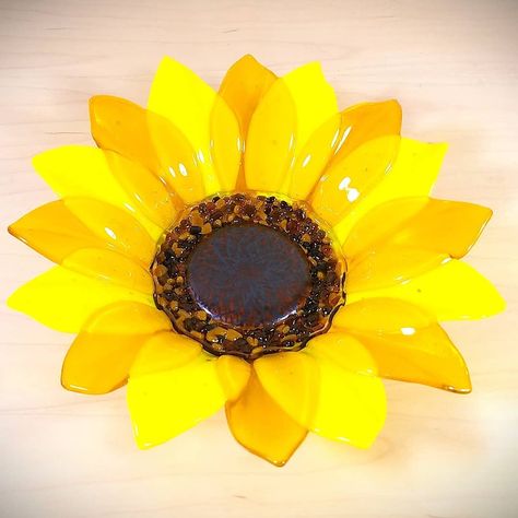 I was privileged to create this 12 inch diameter sunflower bowl as a commission for an awesome friend of mine 🌻 #fusedglassartist , #fusedglassart. #kilnformedglass , #utahartist , #utahglassart , #flowerpower, #floralart, #utahcrafts,  #sunflowers, #homedecor Glass Sunflower, Glass Fusion Ideas, Bullseye Glass, Flower Bowl, Tabletop Decor, Yellow Sunflower, Fused Glass Art, Glass Flowers, Art Table