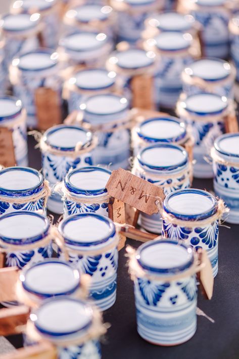 Blue and white talavera shot glasses pictured with the bride and groom's initials tagged. Wedding Favors For Guests Mexican, Mexico Wedding Party Favors, Blue Hacienda Wedding, Wedding Favors Mexican, Mexican Wedding Party Favors, Blue And White Talavera Wedding, Blue Talavera Wedding, Colombian Wedding Ideas, Mexico Wedding Favors