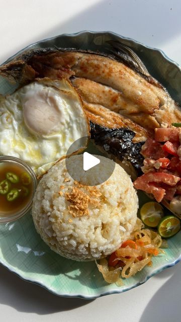 krizkitch on Instagram: "🐟 Bangsilog (Filipino Breakfast Plate with Milkfish)

A silog is a Filipino breakfast composed of three parts: sinangag or garlic fried rice, itlog aka fried egg, plus the addition of a type of protein. In this dish, the protein is daing na Bangus.

Daing na bangus is a traditional Filipino dish made by marinating butterflied milkfish in a mixture of vinegar, garlic, and spices. The fish is then pan-fried until crispy, with the skin left on for added crunch, but instead of pan frying, I decided to airfry for an alternative way of cooking. This plate is paired with atchara, salted duck egg and tomato, with a side of spicy vinegar. 

Bangus: 
Spray or brush both sides of bangus with oil. Spray or brush airfryer with oil as well to prevent sticking. Set airfryer to 3 Salted Duck Egg Dishes, Spicy Vinegar, Egg And Tomato, Filipino Breakfast, Garlic Fried Rice, Filipino Dish, Pan Frying, Filipino Dishes, Breakfast Plate