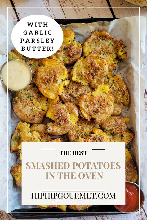 smashed potatoes piled onto a parchment lined baking sheet with 2 dipping sauces Smashed Golden Potatoes, Oven Smashed Potatoes, Golden Potato Recipes, Smash Potatoes, Potatoes Oven, Parsley Butter, Golden Potatoes, Smashed Potatoes Recipe, Potatoes In Oven