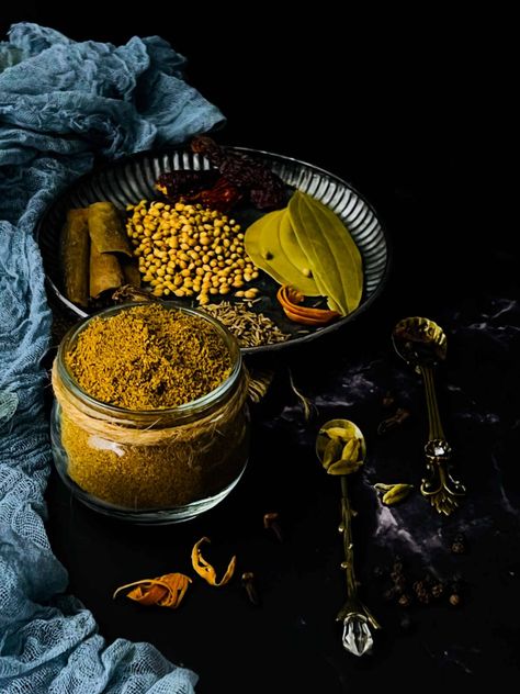 Garam masala in a glass jar with whole spices in the background. Homemade Garam Masala, Garam Masala Recipe, Indian Christmas, Homemade Curry Powder, Whole Spices, Indian Cookbook, Spice Blends Recipes, Homemade Spice Blends, Christmas Recipe