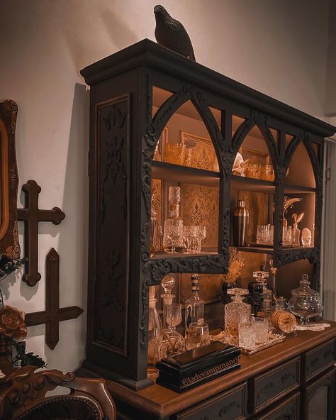 𝔏𝔢𝔱 𝔱𝔥𝔢𝔯𝔢 𝔟𝔢 𝔩𝔦𝔤𝔥𝔱🕯️ Nearly finished with the new cabinet. What do you think? We are onto new projects already! #ladyvampinteriors #vampmanor #darkmakeover #whiskeybar #whiskeylover #furnitureartist #victoriangothfurniture #gothfurnituremakeover #victoriangoth #victoriangothicdecor #vampireaesthetic Gothic Cabinets, Gothic China Cabinet, Gothic Taxidermy Decor, Bone Carver, Gothic Furniture Storage Cabinets, Black Gothic Cabinet, Victorian Gothic Decor, Let There Be Light, Whiskey Bar