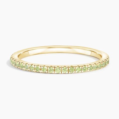 Luxe Ballad Peridot Wedding Ring - 18K Yellow Gold. This petite ring features scalloped pavé peridot in elegantly sculpted prongs that extend three-fourths of the way around the band, leaving a small sizing bar in back. Peridot Wedding Band, Peridot Wedding Ring, Peridot Ring Gold, Peridot Rings, Dream Engagement, Dream Engagement Rings, Peridot Ring, Wedding Things, Wedding Band