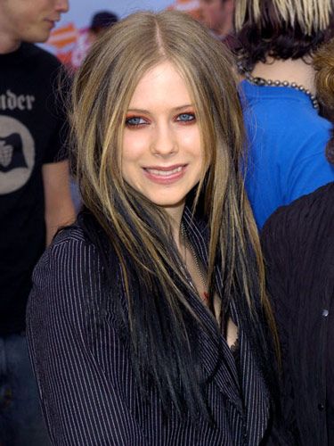 Annnd the eyeliner's back! Avril went vamp at the Kids' Choice Awards, combining her new fave eyeshadow color (red!) and her typical dark liner. She also added some black extensions to her naturally light brown hair. While it's cool she tries new things, we doubt the stylish Cullen fam would approve!   - Seventeen.com Toni And Guy Salon, Brown And Black Hair, Black Extensions, Avril Lavigne Style, Skunk Hair, Black Brown Hair, Kids Choice Awards, Beauty Makeover, Brown Hair Dye