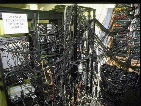 Poor data center cable management.  I'm expecting Shelob the spider from Lord of the Rings to emerge any moment. Computer Objectum, Objectum Computer, Sentient Computer, Computer Wires, Computer Aesthetic, Center Management, Computer Love, Ham Radio Antenna, Server Room