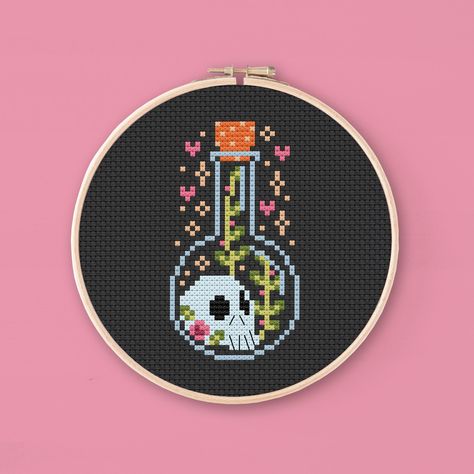 Cross stitch pattern of a skull inside a potions bottle. This tiny cute pattern is a perfect project for beginners and is also great to test out black Aida for the first time. The spooky little bottle will look great on a 4 inch hoop.  Grab your needles, prepare some tea and cookies and start stitching this project! It's super easy to stitch and will make the perfect Valloween gift. Do you like this pattern? There is a whole Collection! Love Spell I - Mushrooms and Leaves: https://www.etsy.com/listing/1652070288 Love Spell III - Ghosts and Memories: https://www.etsy.com/listing/1666248235 Love Spell Bundle - All three patterns together!: https://www.etsy.com/listing/1652079086 * The pattern * This listing is for a digital PDF, not a finished product! The PDF includes: - A mockup of the fin Potion Bottles Cross Stitch, Mushroom Cross Stitch Pattern Free, Kingdom Hearts Cross Stitch, Black Aida Cross Stitch, D&d Cross Stitch, Witchy Pixel Art, Cross Stitch Patterns Beginner, Tiny Cross Stitch Patterns, Cottagecore Cross Stitch