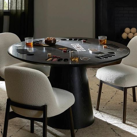 FREE White Glove Upgrade Enjoy FREE White Glove shipping upgrade. Includes Room of Choice setup & assembly and removal of packaging at no additional cost. A fun reinterpretation of a modern dining table, this poker table is the ultimate companion for game night, complete with chip and drink cutouts. The piece pairs a stone top with a substantial tapered, cylindrical base in tonal matched wood for a monochromatic statement. 51.25in W x 51.25in D x 30in H Color: White Marble/Weathered Dark Oak or Home Poker Table, Chess Table And Chairs Living Rooms, Living Room Card Table, Modern Game Table, Modern Poker Table, Poker Table Ideas, Poker Table Design, Game Table In Family Room, Poker Room Ideas