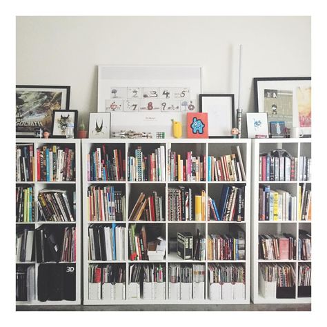 Books on Books | 64 cubes of books! 4 shelves spread out the wall. Bought from Ikea. Cube Organizer With Books, Stacked Cube Shelves, Cube Bookshelf, Kallax Bookshelf, Stairwell Wall, Wall Cubes, Square Shelf, Bookshelf Organization, Cube Bookcase