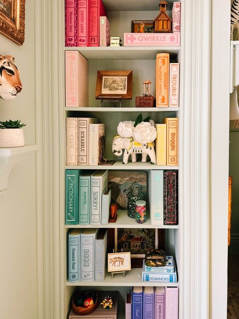 turn board games to display books. Storage solutions that are smart and stylish to organize board games. A beautiful way to keep games on a shelf. A simple craft that is fast and easy Board Game Corner Ideas, Book Storage Design, Vintage Bookshelf Games, How To Store Cards And Letters, Board Game Closet Organization, Bookshelf Board Games, Kids Board Game Storage, Aesthetic Board Game Storage, Bedroom Book Display