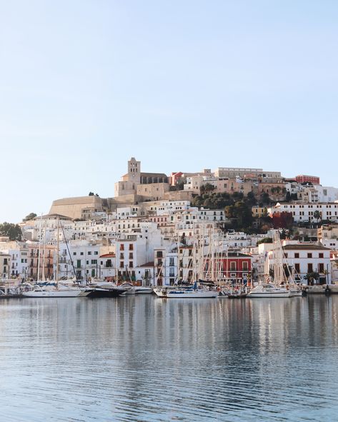 The Ibiza Town Marina on the Mediterranean, full of expensive looking yachts. The playground of the rich and famous, yet, Ibiza still captures the slow life of Spain. Boutique shops and fancy restaurants line the shore and make the perfect spot to grab a coffee and soak up the Spanish Summer Sun. Ibiza Town Aesthetic, Ibiza 90s, Travel Ibiza, Ibiza Old Town, Ibiza Vibes, Spanish Summer, Ibiza Party, Ibiza Formentera, Europe 2024